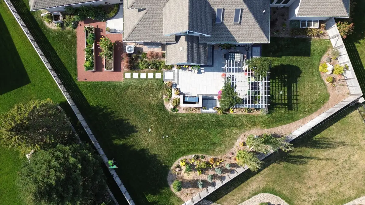 Aerial view of backyard hardscape with patio and walkways