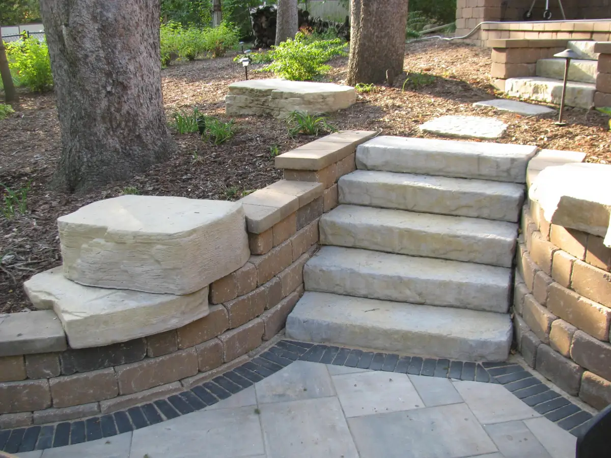 Natural stone steps through landscape plantings and garden beds